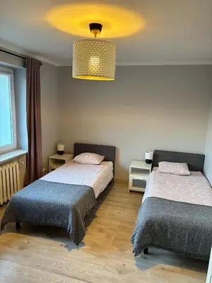 Łóżko lub łóżka w pokoju w obiekcie Agroturystyka pod lasem
