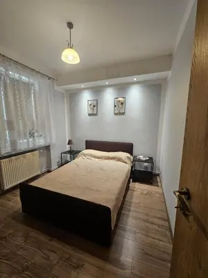 Łóżko lub łóżka w pokoju w obiekcie Miły Apartament