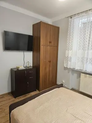 Łóżko lub łóżka w pokoju w obiekcie Miły Apartament