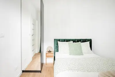 Łóżko lub łóżka w pokoju w obiekcie Legnicka Residence apart