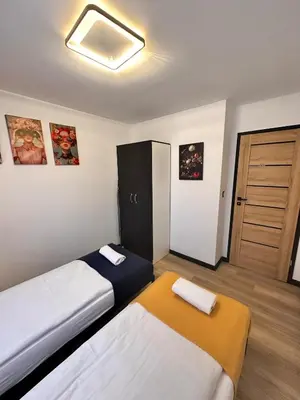 Łóżko lub łóżka w pokoju w obiekcie Apartament w Rynku - Duszniki- Zdrój