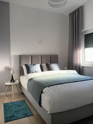 Łóżko lub łóżka w pokoju w obiekcie Apartament Jana Pawła