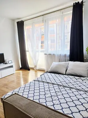 Łóżko lub łóżka w pokoju w obiekcie Rynek Golden Stay by Grafit