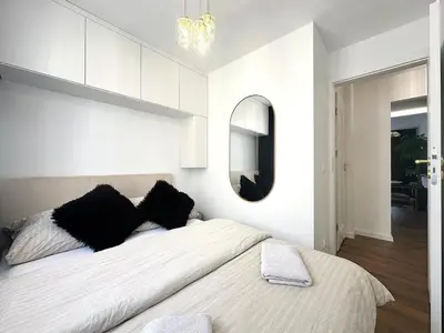 Łóżko lub łóżka w pokoju w obiekcie Wita Stwosza 14 Apartment - Check-In 20h - Parking