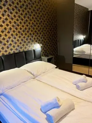 Łóżko lub łóżka w pokoju w obiekcie LOFT APARTAMENT IV Namysłów