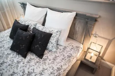 Łóżko lub łóżka w pokoju w obiekcie Hotel Wodnik
