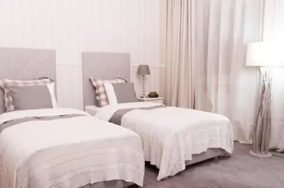 Łóżko lub łóżka w pokoju w obiekcie Hotel Wodnik