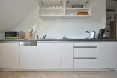 Kuchnia lub aneks kuchenny w obiekcie Apartamenty Zielony Dom