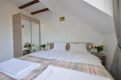 Łóżko lub łóżka w pokoju w obiekcie Apartamenty Zielony Dom