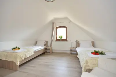 Łóżko lub łóżka w pokoju w obiekcie Apartamenty Zielony Dom