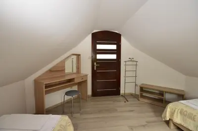 Łóżko lub łóżka w pokoju w obiekcie Apartamenty Zielony Dom