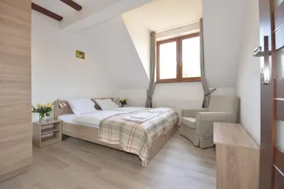 Łóżko lub łóżka w pokoju w obiekcie Apartamenty Zielony Dom