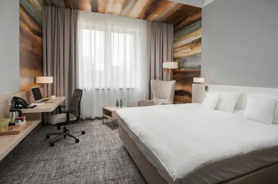Łóżko lub łóżka w pokoju w obiekcie Park Hotel & Restauracja Browar Brzeg