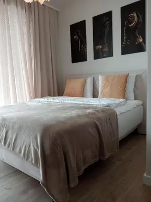 Łóżko lub łóżka w pokoju w obiekcie Klonowa 4 4