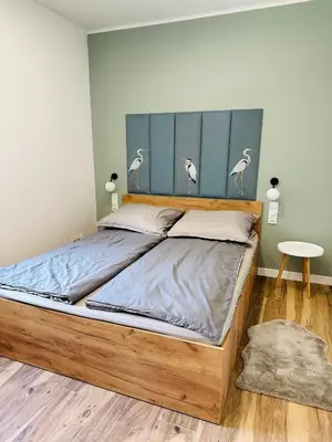 Łóżko lub łóżka w pokoju w obiekcie Apartamenty Dębowa 8 Leśny Zakątek