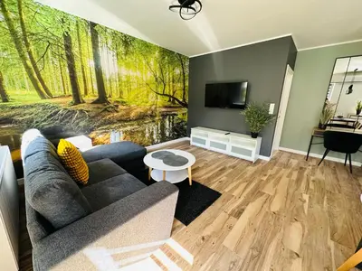 Telewizja i/lub zestaw kina domowego w obiekcie Apartamenty Dębowa 8 Leśny Zakątek