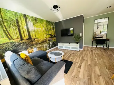 Telewizja i/lub zestaw kina domowego w obiekcie Apartamenty Dębowa 8 Leśny Zakątek
