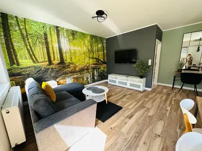 Telewizja i/lub zestaw kina domowego w obiekcie Apartamenty Dębowa 8 Leśny Zakątek