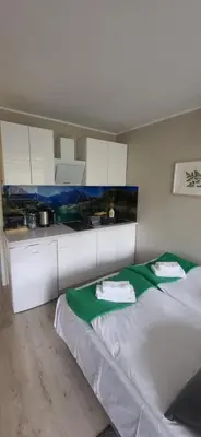 Łóżko lub łóżka w pokoju w obiekcie W KORONACH DRZEW Apartamenty Polanica-Zdrój