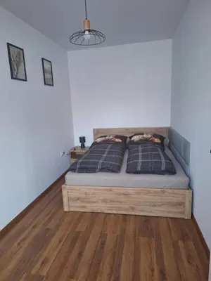 Łóżko lub łóżka w pokoju w obiekcie Apartamenty przy Armii Krajowej II
