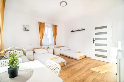 Łóżko lub łóżka w pokoju w obiekcie Hostel PW INVEST HOME
