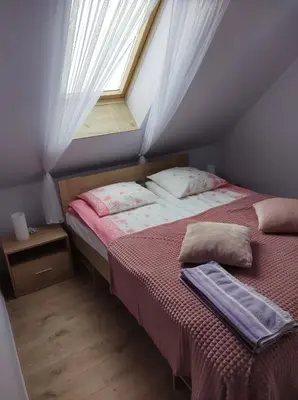 Łóżko lub łóżka w pokoju w obiekcie Pensjonat Lissa