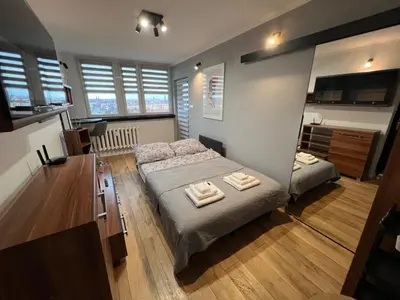 Łóżko lub łóżka w pokoju w obiekcie Apartament Galactica