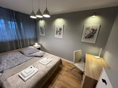 Łóżko lub łóżka w pokoju w obiekcie Apartament Galactica