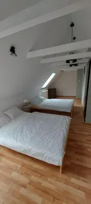 Łóżko lub łóżka w pokoju w obiekcie Domek Chrzanówka
