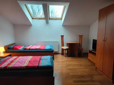 Łóżko lub łóżka w pokoju w obiekcie Pokoje Gościnne pod Dębem