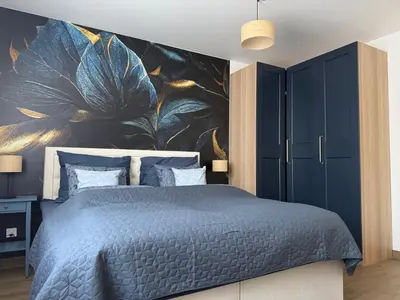 Łóżko lub łóżka w pokoju w obiekcie Apartament Elegancka Husarska