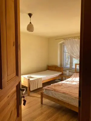 Łóżko lub łóżka w pokoju w obiekcie Wytchnienie