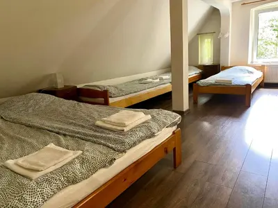 Łóżko lub łóżka w pokoju w obiekcie Wytchnienie