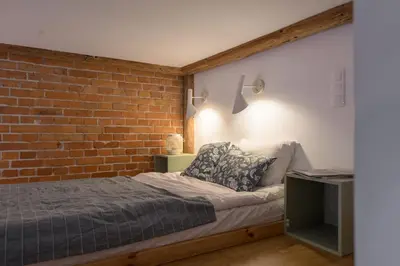 Łóżko lub łóżka w pokoju w obiekcie Oak Doors Apartament w Rynku - ProperUNIT