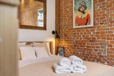 Łóżko lub łóżka w pokoju w obiekcie Oak Doors Apartament w Rynku - ProperUNIT