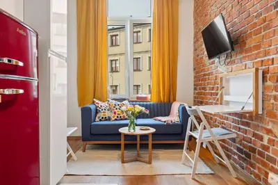 Telewizja i/lub zestaw kina domowego w obiekcie Red Brick Apartament w Rynku - ProperUNIT