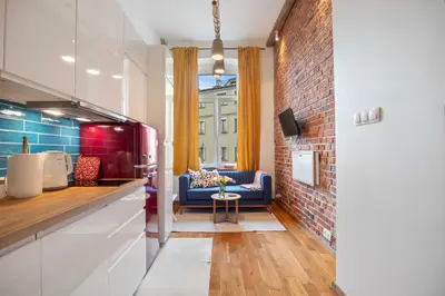 Telewizja i/lub zestaw kina domowego w obiekcie Red Brick Apartament w Rynku - ProperUNIT