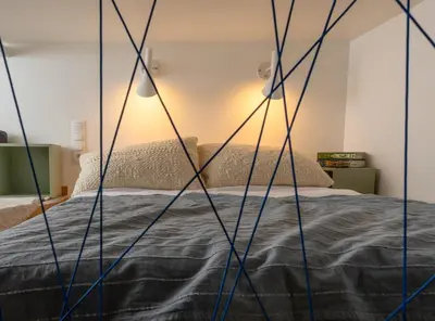 Łóżko lub łóżka w pokoju w obiekcie Red Brick Apartament w Rynku - ProperUNIT