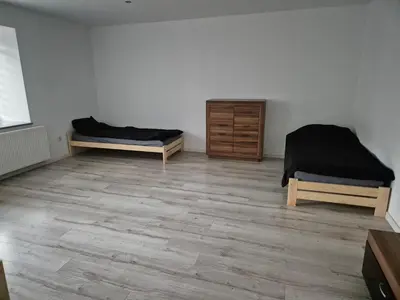 Łóżko lub łóżka w pokoju w obiekcie Noclegi kwatery dla firm
