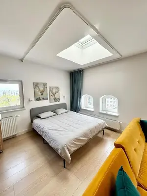 Łóżko lub łóżka w pokoju w obiekcie Penthouse in heart of Wroclaw