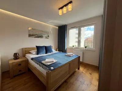 Łóżko lub łóżka w pokoju w obiekcie Nowy Apartament Mikołowska Premium