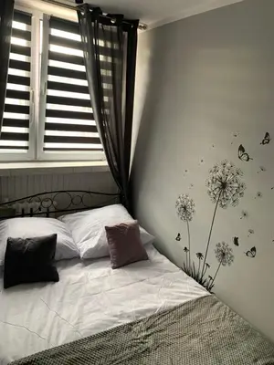 Łóżko lub łóżka w pokoju w obiekcie Apartament na Jasnym