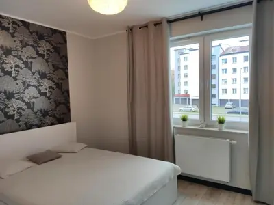 Łóżko lub łóżka w pokoju w obiekcie Apartament Piastowski