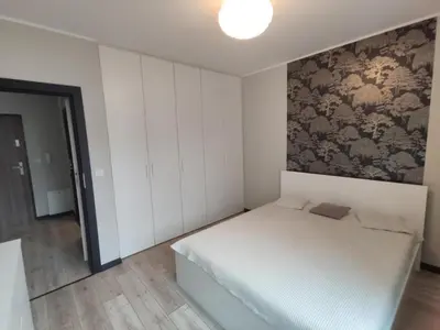 Łóżko lub łóżka w pokoju w obiekcie Apartament Piastowski