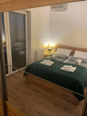 Łóżko lub łóżka w pokoju w obiekcie Apartament z dużym tarasem - najbliżej PreZero