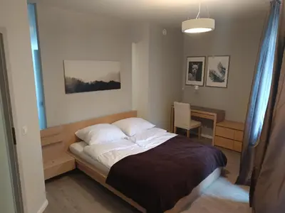 Łóżko lub łóżka w pokoju w obiekcie Apartament Dominikanski