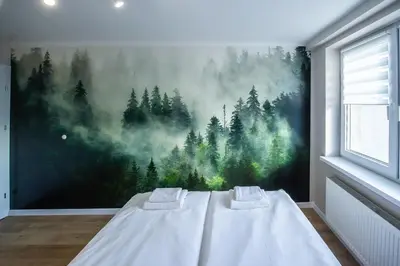 Łóżko lub łóżka w pokoju w obiekcie Apartament Korfantego 9