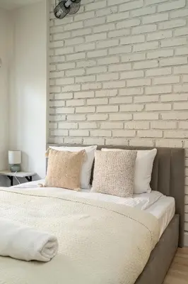 Łóżko lub łóżka w pokoju w obiekcie RentPlanet - Apartament Szczytnicka