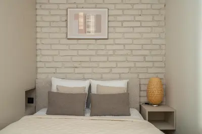 Łóżko lub łóżka w pokoju w obiekcie RentPlanet - Apartament Szczytnicka
