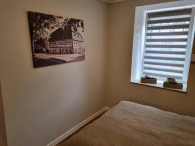 Łóżko lub łóżka w pokoju w obiekcie Apartament Pod jeleniem